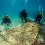 A handout photo from 31 August 2017 shows archaeologists diving at the site of the ancient Roman city of Neapolis