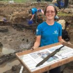 Volunteer Sarah Baker who discovered the second sword at Vindolanda (The Vindolanda Trust).