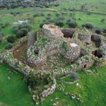 WHO ERECTED MORE THAN 7000 ANCIENT NURAGHE TOWERS ON AN ITALIAN ISLAND?